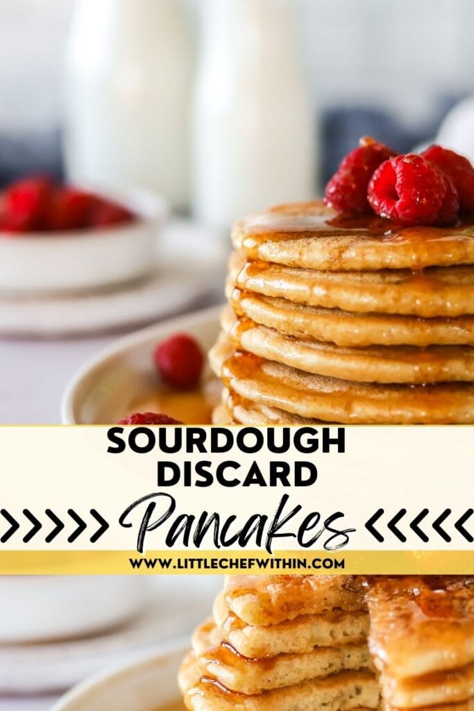 A stack of 7 sourdough pancakes with fresh berries on top covered in maple syrup.