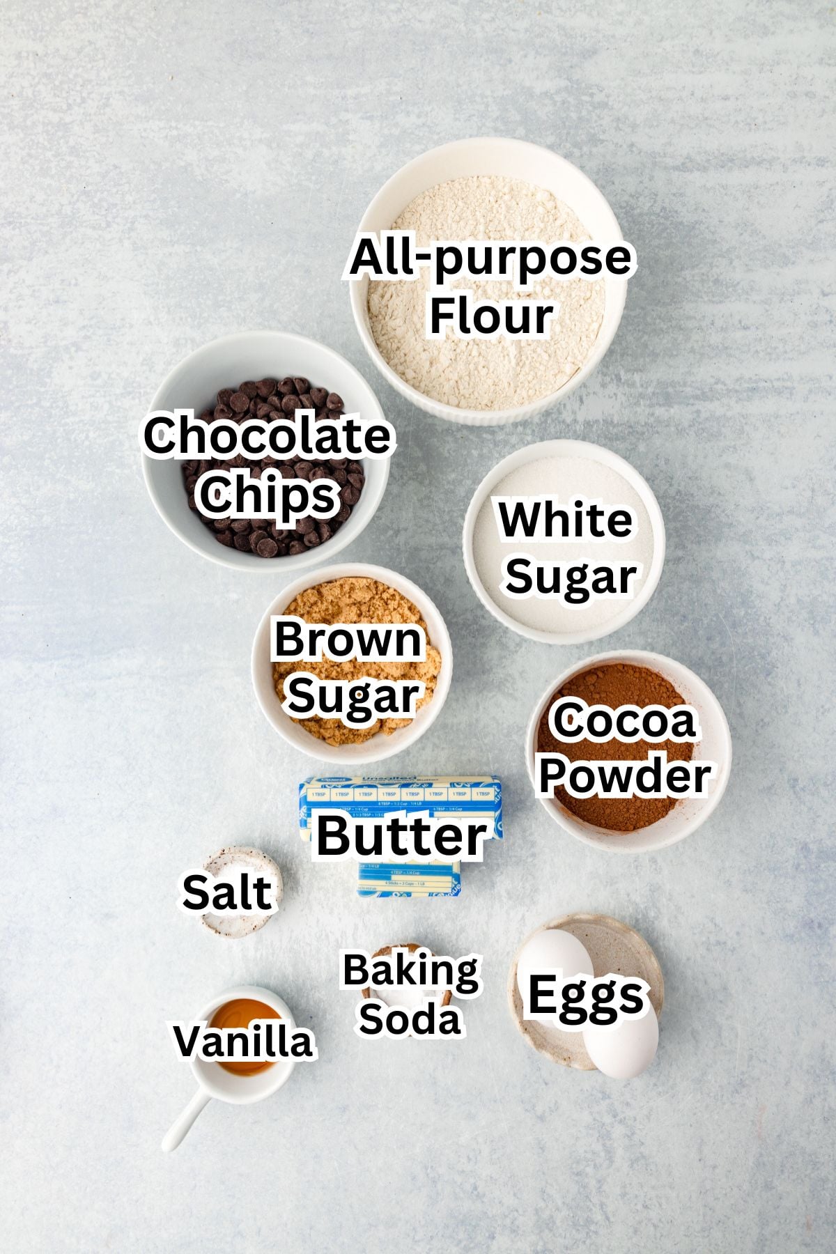 All-purpose flour, chocolate chips, white sugar, brown sugar, cocoa powder, butter, eggs, vanilla, baking soda, salt.