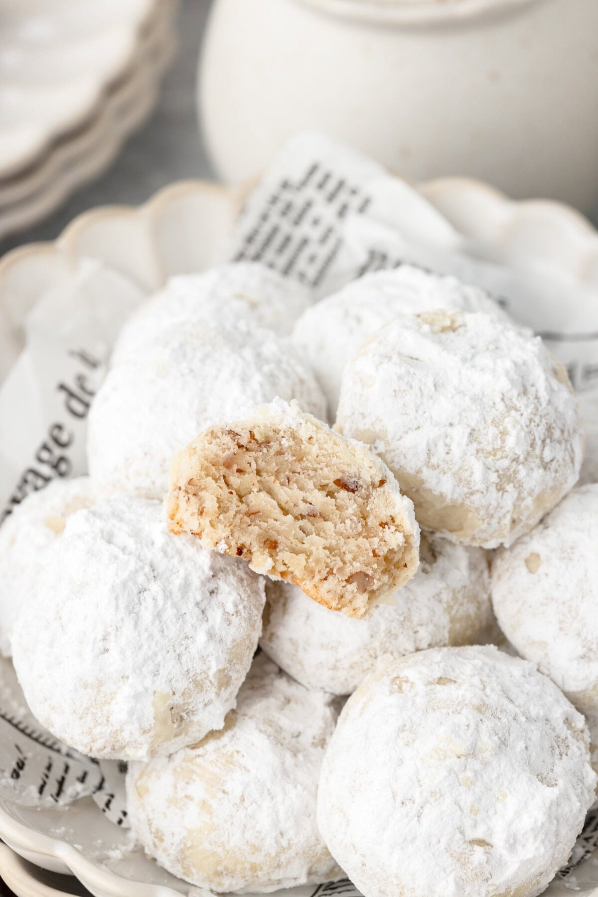 Powdered sugar-coated caramel cookies with soft, chewy centers and crunchy exterior.