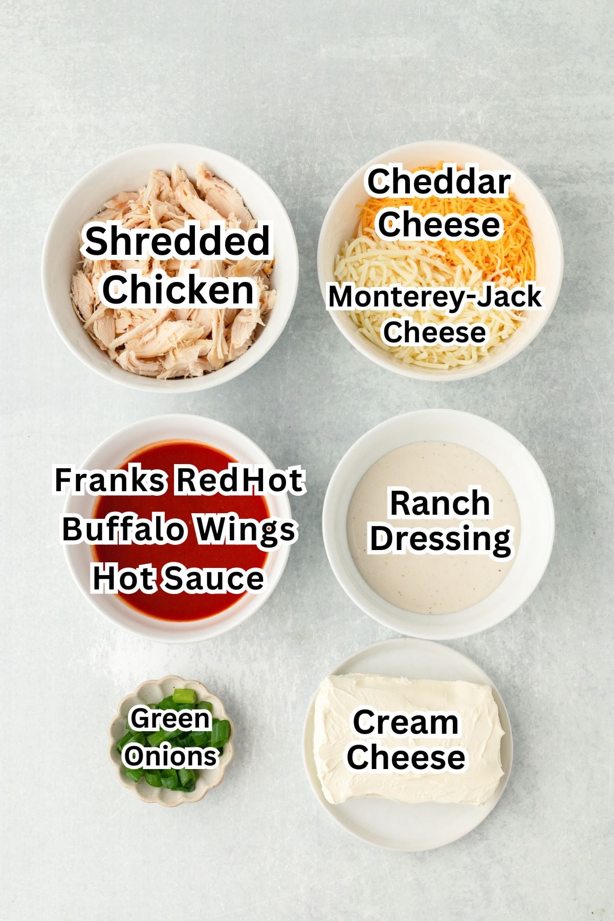 Shredded chicken in a white bowl for recipe preparations.