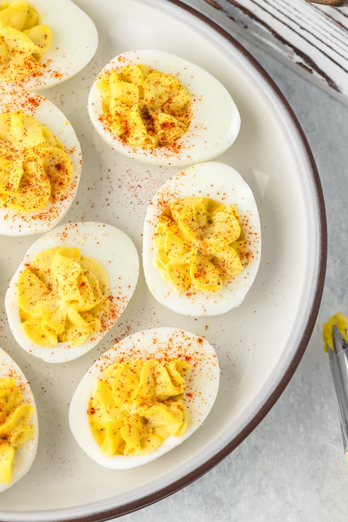 Deviled eggs with creamy filling and paprika topping.