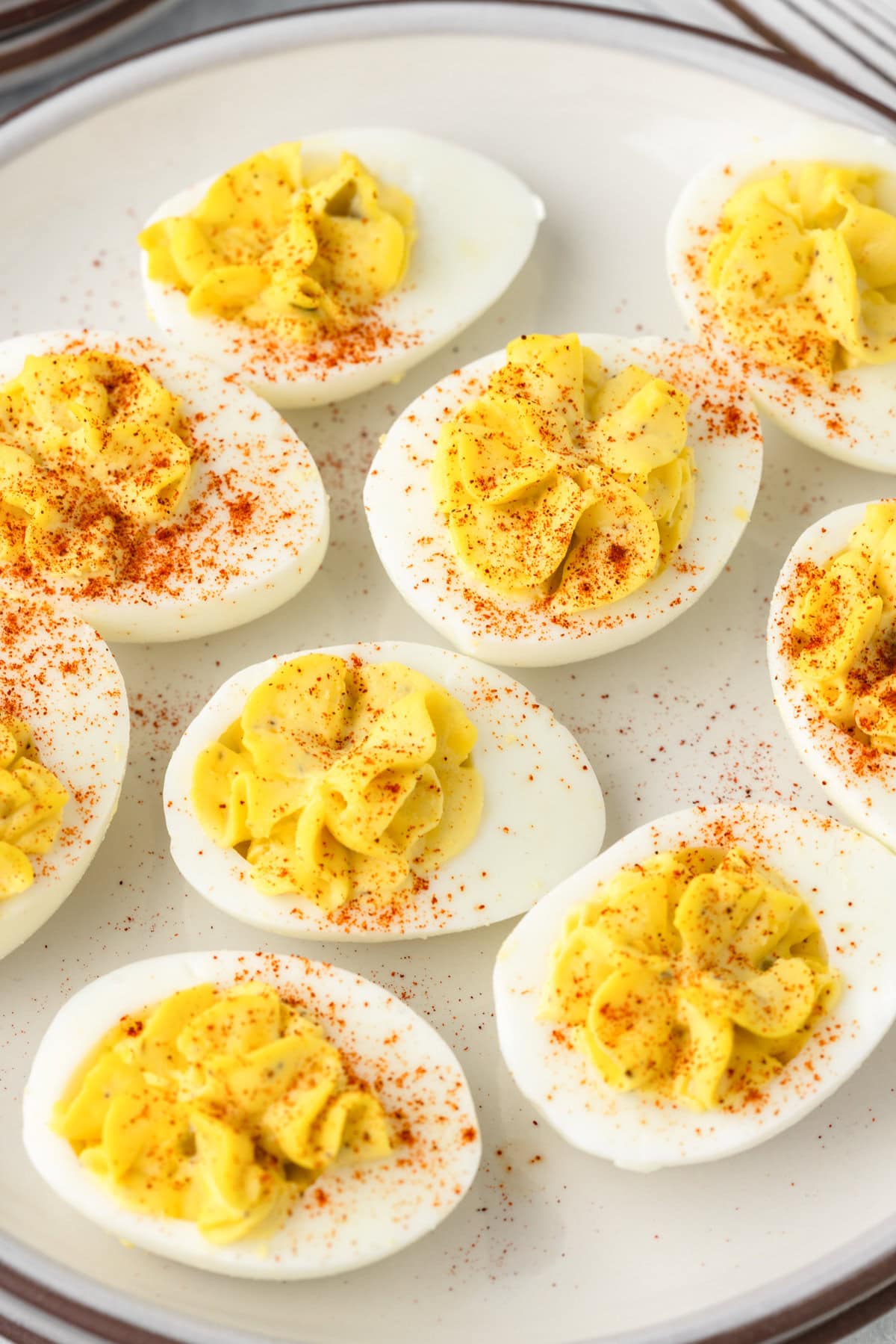 Creamy deviled eggs with paprika and mustard.
