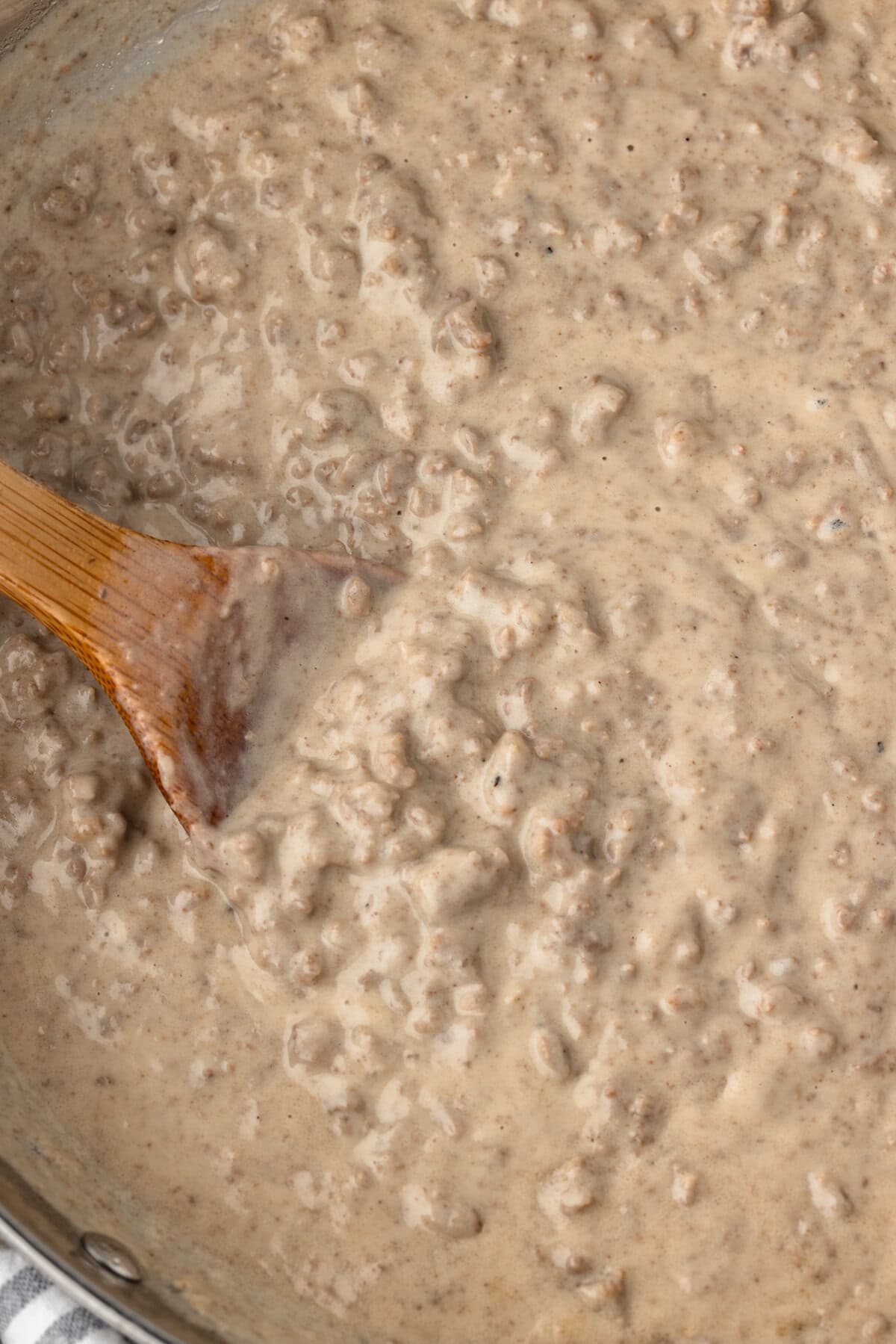 Hamburger gravy with a rich, creamy texture and savory flavor. Perfect for serving over mashed potat.