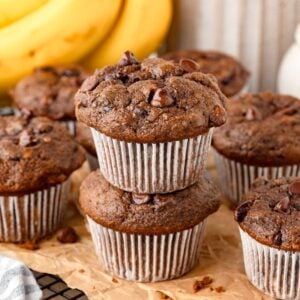 Einkorn Chocolate Banana Muffins on brown parchment paper.