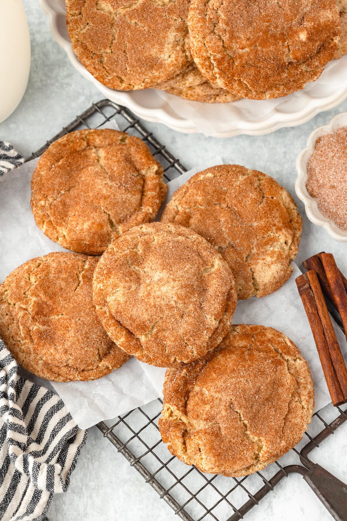 Fresh milled flour snickerdoodles with cinnamon sugar coating on a cooling rack.