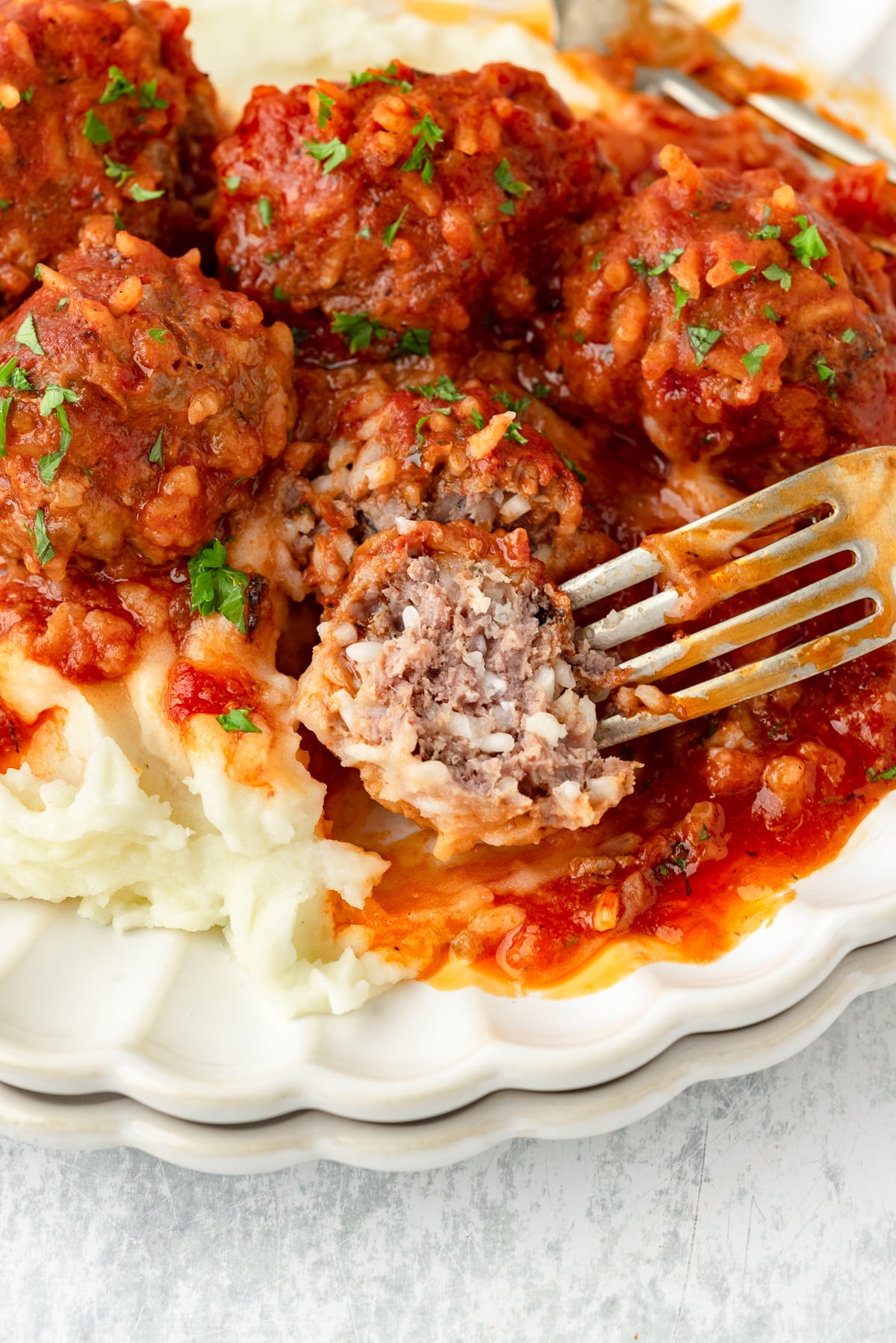 Porcupine Meatballs with tomato sauce and mashed potatoes, savory and hearty.