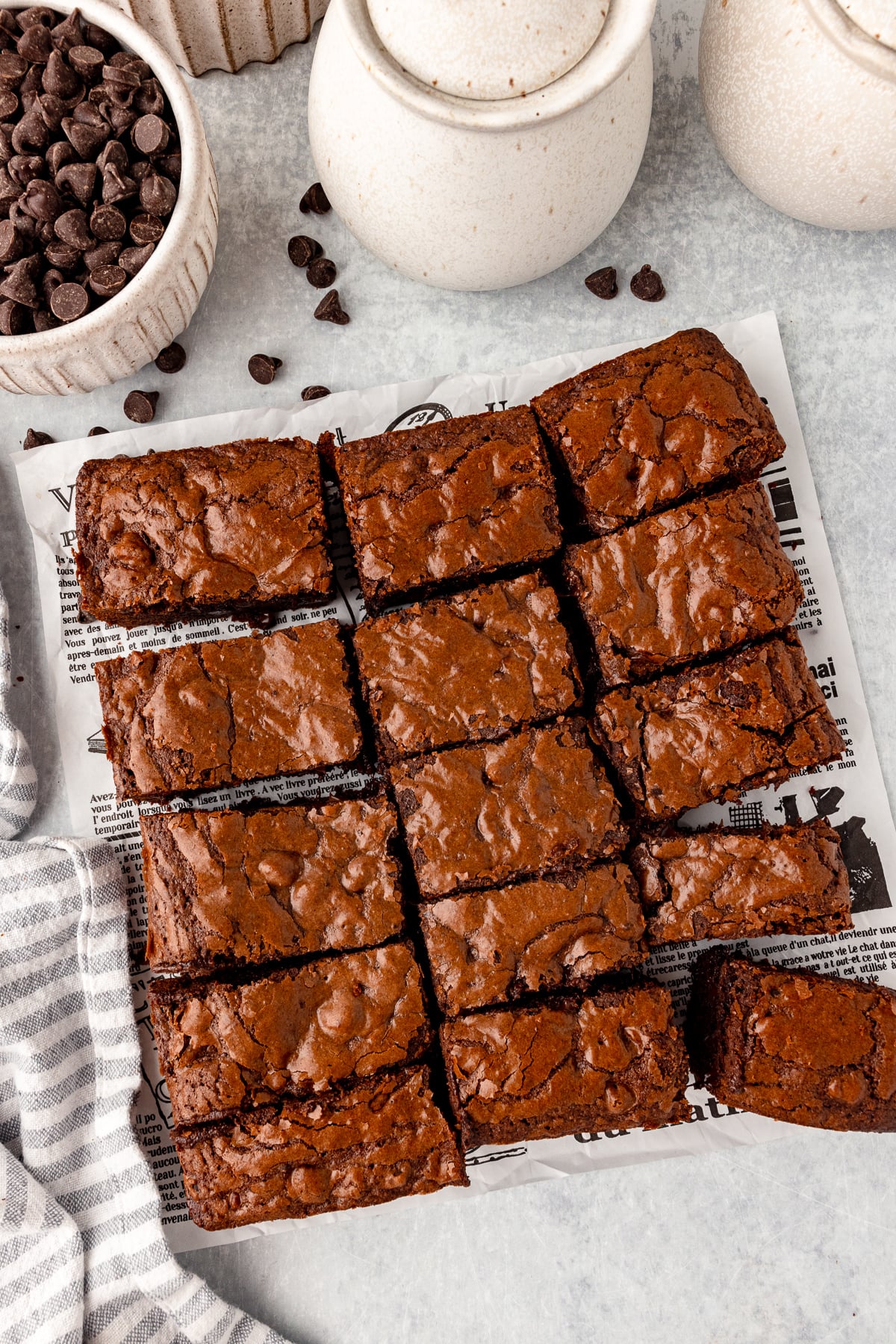 Fudgy spelt brownies with a cracked top and rich chocolate appearance.