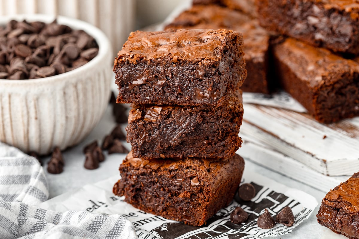 Fudgy spelt brownies with a rich, chocolatey appearance and a slightly cracked top.