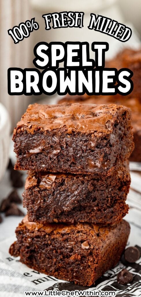 Fudgy spelt brownies with a rich, chocolatey appearance and a slightly cracked top.