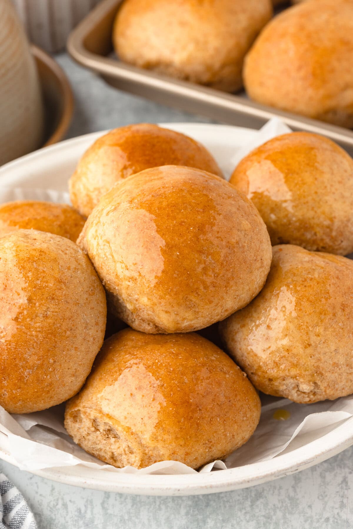 Fresh milled flour dinner rolls made with milled flour, golden and fluffy.
