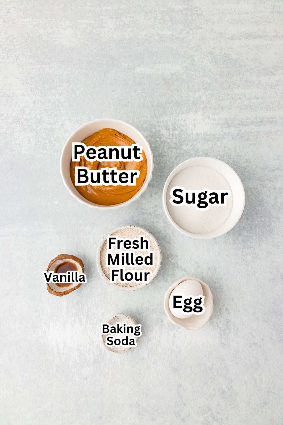 Peanut butter, sugar, flour, egg, and baking soda for cookies.