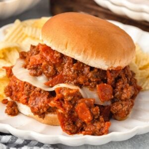 Pizza Sloppy Joes with seasoned meat and cheese in a soft bun.